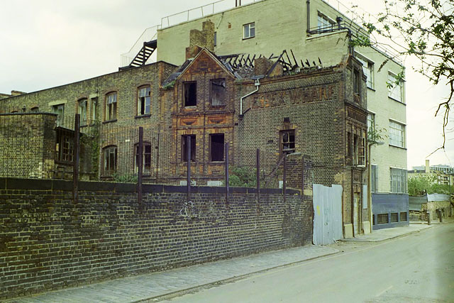 Essex Wharf, Durward Street, 1988 The viewpoint is just about where the body of Jack the Ripper victim Mary Ann Nichols was found 100 years before the photograph. The street was then called Buck's Row. The "Wharf" name did not indicate a nearby navigation, but possibly the nearby railway yards.. Modern photograph (1988): the site as it was then, not in 1888